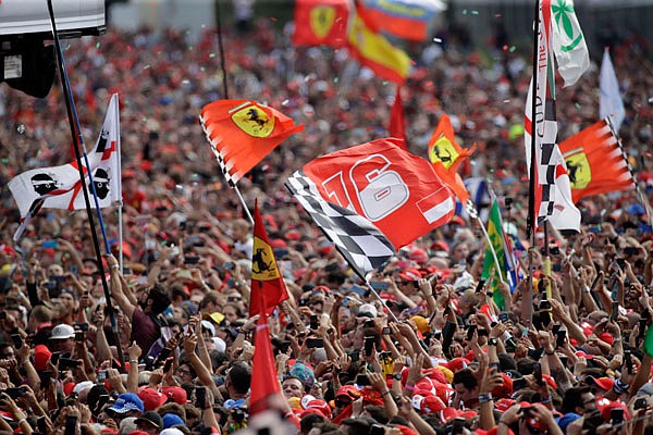 Ferrari fans celebrate Sunday after Charles Leclerc won the Formula One Italy Grand Prix at the Monza racetrack in Monza, Italy.