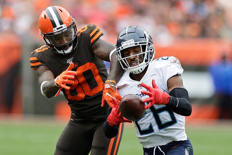  Tennessee Titans cornerback Logan Ryan (26) intercepts a throw intended for Cleveland Browns wide receiver Jarvis Landry (80) on Sunday in Cleveland. 
