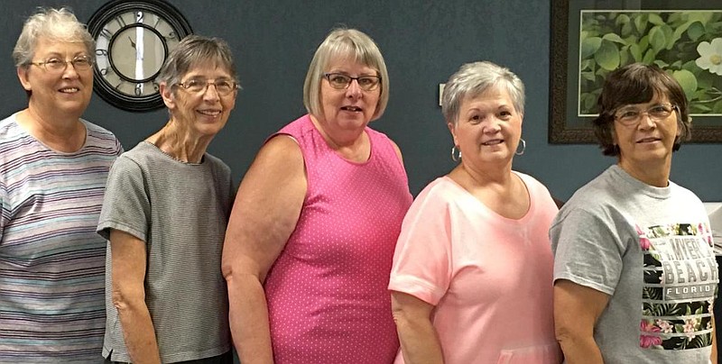 Five California area women meet once per week at the Moniteau County Library to sew bereavement gowns for newborn babies. The ladies, who call themselves the Little Angel Sewing Sisters, are from left: Joyce Crook, Jo Pummill, Diane Eulinger, Debbie Sparks and Linda Bardwell.