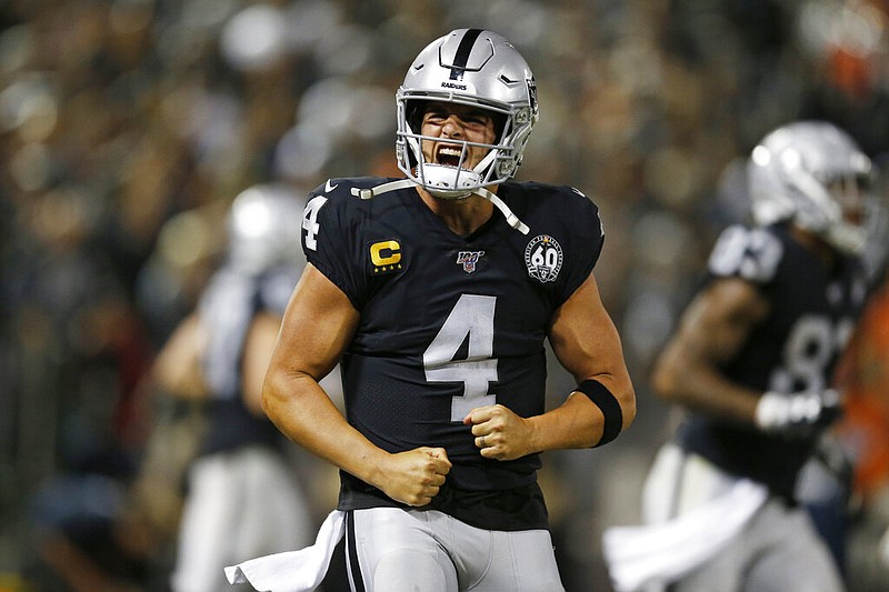 Oakland Raiders quarterback Derek Carr reacts after running back Josh Jacobs scored a touchdown during the fourth quarter of an NFL football game against the Denver Broncos Monday, Sept. 9, 2019, in Oakland, Calif. (AP Photo/D. Ross Cameron)