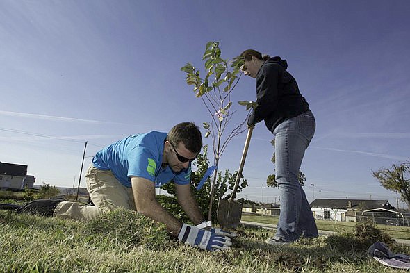 Volunteers come to help planting trees in Joplin after a 2011 tornado. The Missouri Department of Conservation and community partners will offer nearly 400 free trees to local residents impacted by tornado damage this past spring, according to a Monday news release.