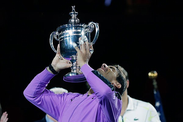 Rafael Nadal raises the trophy Sunday night after winning the men's singles title at the U.S. Open in New York.