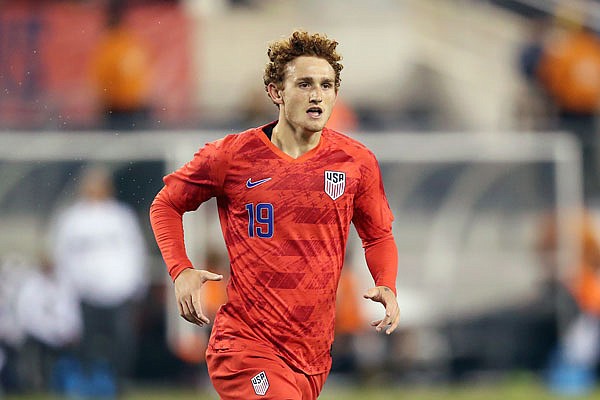 United States forward Josh Sargent runs onto the field during last Friday night's international friendly against Mexico in East Rutherford, N.J. Sargent, a native of the St. Louis area, will get the start tonight for the U.S. in his match against Uruguay at Busch Stadium.