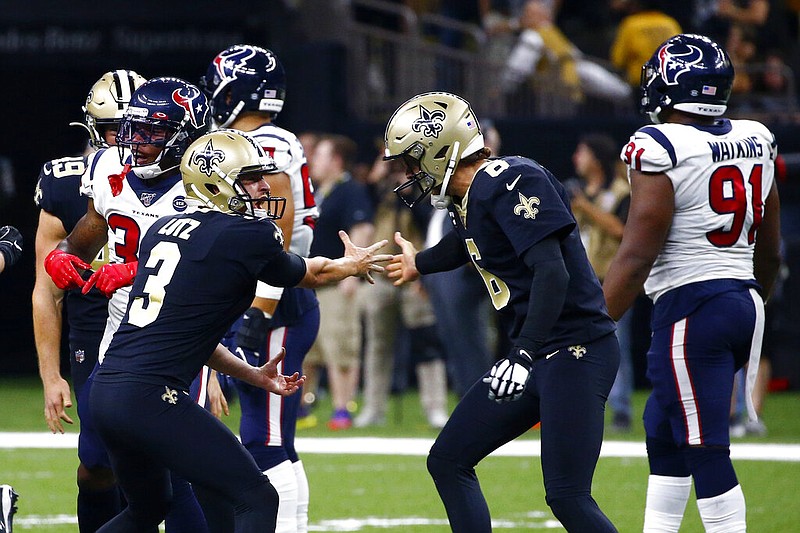 New Orleans Saints kicker Wil Lutz celebrates his game winning 58-yard field goal with holder Thomas Morstead (6) at the end of regulation in the second half of an NFL football game against the Houston Texans in New Orleans, Monday, Sept. 9, 2019. The Saints won 30-28. (AP Photo/Butch Dill)