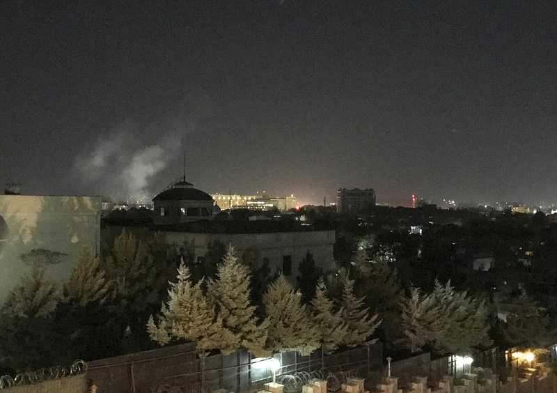 A plume of smoke rises near the U.S. Embassy in Kabul, Afghanistan on Wednesday, Sept. 11, 2019. A blast was heard shortly after midnight on the anniversary of the 9/11 attacks. (AP Photo/Cara Anna)