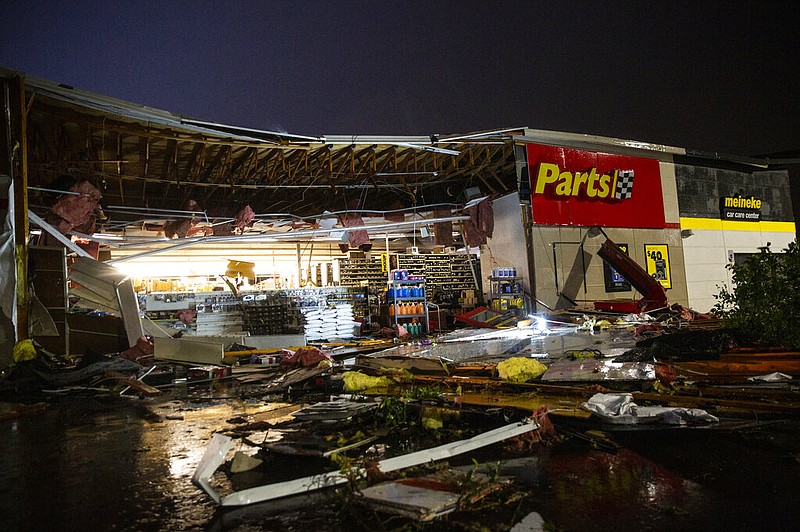 In this Tuesday, Sept. 10, 2019 photo, debris litters the ground at Advance Auto Parts following severe weather in Sioux Falls, S.D.