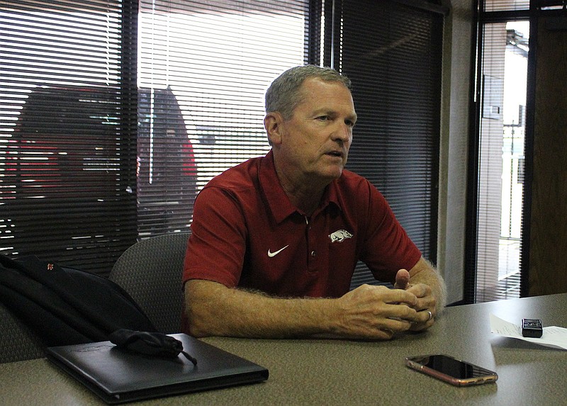 University of Arkansas head baseball coach Dave Van Horn speaks to local media during a press conference Tuesday at the TAC Terminal of the Texarkana Regional Airport  before  the annual Texarkana Razorback Club meeting where Van Horn was guest speaker.