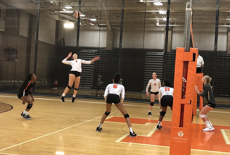 Texas High senior Olivia Lower, who had a match-high 25 kills, prepares to spike the ball in a varsity volleyball match against Pleasant Grove on Tuesday at the Tiger Center. The Lady Hawks won, 25-17, 22-25, 25-23, 25-21.