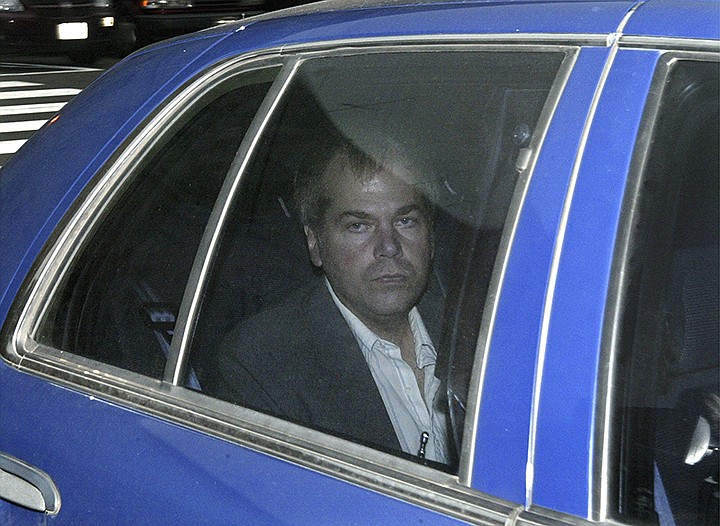 In this Nov. 18, 2003, file photo, John Hinckley Jr. arrives at U.S. District Court in Washington. The man who tried to assassinate President Ronald Reagan is interested in getting a job in the music industry, possibly in California. That's what a lawyer for 64-year-old John Hinckley Jr. told a judge at a court hearing Tuesday in Washington. But a prosecutor said that would give the government "great pause."  (AP Photo/Evan Vucci, File)