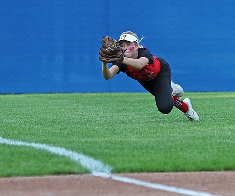 Jefferson City left fielder Brooke Bates makes a diving catch during Tuesday's game against Fatima at Vogel Field.