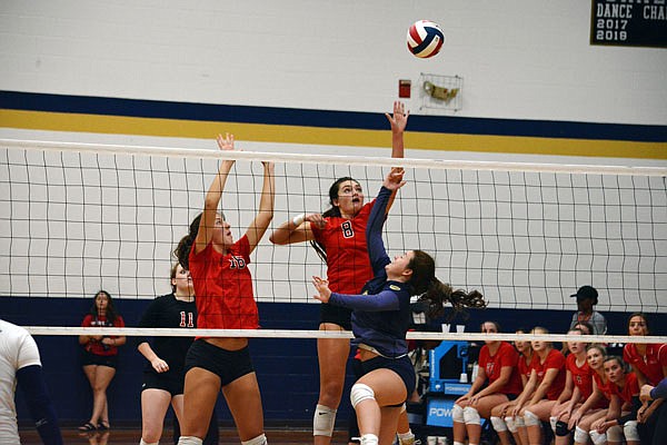 Annabelle Maassen of Jefferson City hits the ball over the net during Tuesday night's match against the Helias Lady Crusaders at Rackers Fieldhouse.