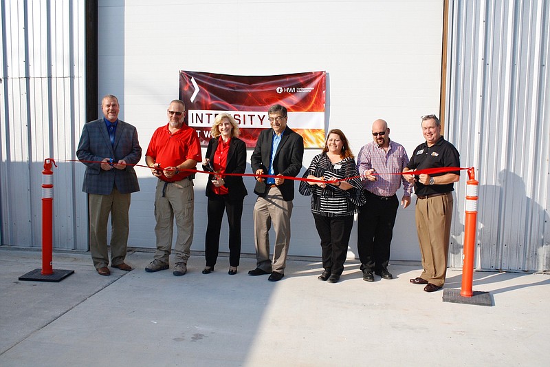 <p>Quinn Wilson/For the News Tribune</p><p>The ribbon was cut Wednesday morning at the recently opened Fulton Rotary Kiln facility, operated by HarbisonWalker International. Pictured, from left, are Kevin Ballard, HWI’s executive director of engineering and process improvement; Plant Manager Dave Keller; HWI CEO Carol Jackson; Callaway County Western District Commissioner Roger Fischer; Callaway Chamber of Commerce Executive Director Tamara Tateosian; Fulton Mayor Lowe Cannell; and Bruce Hackmann, Callaway Chamber of Commerce economic development director.</p>