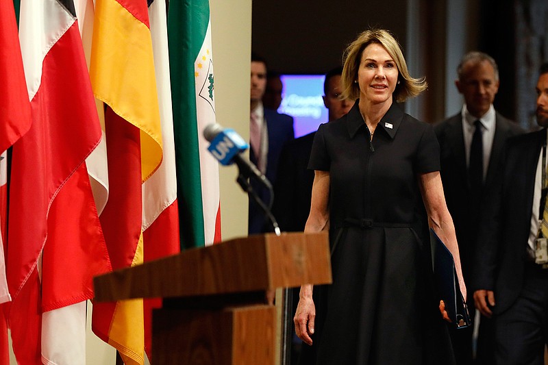 New U.S. Ambassador Kelly Craft walks to the podium to address the press after attending her first Security Council meeting, at United Nations headquarters, Thursday, Sept. 12, 2019. (AP Photo/Richard Drew)