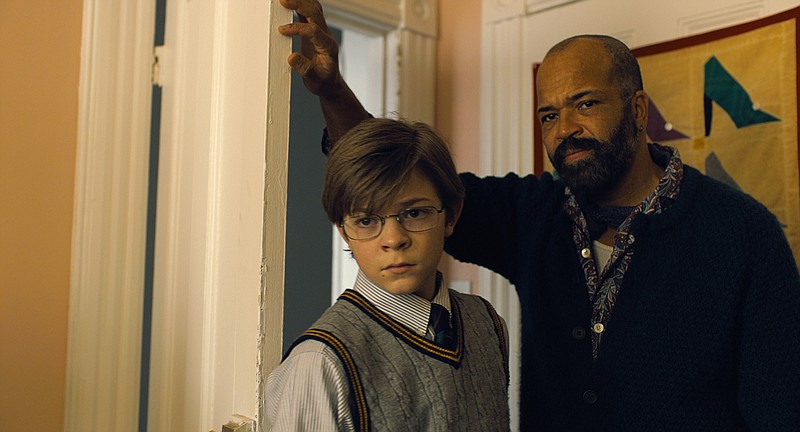 From left, Oakes Fegley and Jeffrey Wright in the film, "The Goldfinch." (Warner Bros. Pictures/TNS)