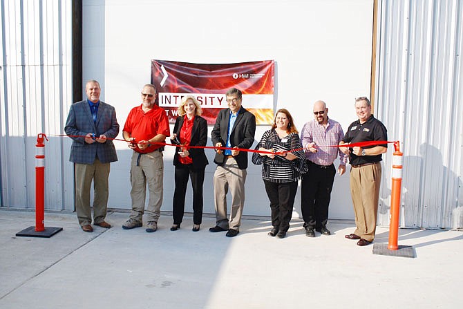 On Wednesday morning, the ribbon was cut at the recently opened Fulton Rotary Kiln facility, operated by HarbisonWalker International. Pictured, from left, are Kevin Ballard, HWI's executive director of engineering and process improvement; Dave Keller, plant manager; Carol Jackson, HWI's CEO; Roger Fischer, Callaway County's western district commissioner; Tamara Tateosian, Callaway Chamber of Commerce's executive director; Mayor Lowe Cannell; and Bruce Hackmann, chamber of commerce's economic development director.