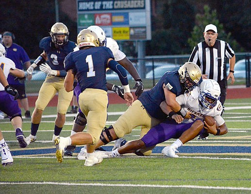 Will Heckman of Helias makes a tackle during last Friday night's 24-0 win against Hickman at Ray Hentges Stadium.