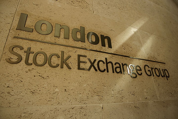 This Thursday, Sept. 22, 2011 file photo shows a sign outside the Stock Exchange in the City of London. The Hong Kong stock exchange said Wednesday Sept. 11, 2019, it has started talks to buy the London Stock Exchange that would value the British company at 29.6 billion pounds ($36.6 billion). The Hong Kong Exchanges and Clearing Ltd. said a deal would provide the London Stock Exchange with a key opening to Asian markets and underpin the British capital's role as a financial hub. (AP Photo/Matt Dunham, File)