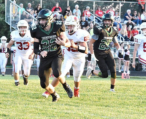 North Callaway running back Trevor Ray separates himself from a pair of Tipton defenders in the Thunderbirds' 60-16 win against the Cardinals in last Friday's home opener in Kingdom City.