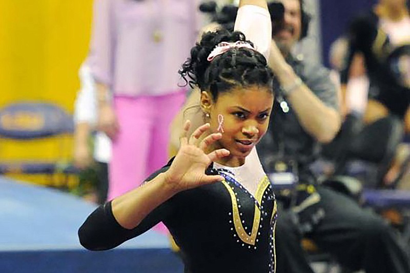 In this March 8, 2013, photo provided by LSU Student Media, LSU senior Britney Taylor finishes her floor routine at a gymnastics event in Baton Rouge, La. New England Patriots wide receiver Antonio Brown has been accused of rape by a former trainer. Britney Taylor says Brown sexually assaulted her on three occasions, according to a lawsuit filed Tuesday, Sept. 10, 2019, in the Southern District of Florida. (Lauren Duhon/LSU Student Media via AP)