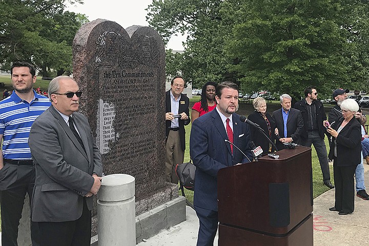  In this April 26, 2018, file photo, Arkansas Republican state Sen. Jason Rapert speaks at the unveiling of a Ten Commandments monument outside the Arkansas state Capitol in Little Rock. An attorney for Rapert on Wednesday, Sept. 11, 2019, asked a federal judge to issue an order limiting the use of any deposition video in the lawsuit challenging the display's constitutionality.(AP Photo/Andrew DeMillo, File)