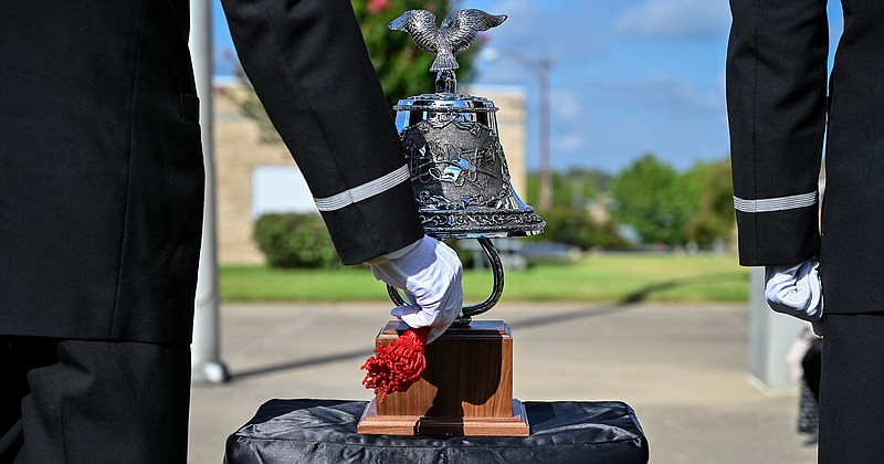 Texarkana, Arkansas, Fire Department's Honor Guard members ring the Honor Bell during a Sept. 11, 2001, memorial for first responders Wednesday at the Downtown Post Office and Federal Courthouse in Texarkana. The bell was rung in three sets of five chimes, signaling "stand down" in honor of the fallen firefighters. The community came together at the courthouse for a moment of silence on the day 18 years ago when the World Trade Center was attacked by terrorists.