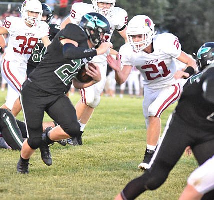 Dylan Kuttenkuler of Tipton closes in on a North Callaway player during last week's game in Kingdom City.