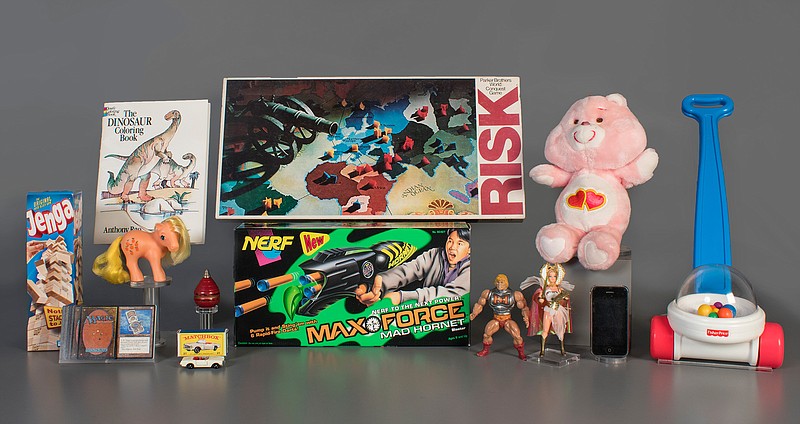 In this Aug. 13, 2019 photo provided by the National Toy Hall of Fame are the 2019 finalists, from left to right, Jenga, Magic the Gathering, My Little Pony, Coloring Book, Matchbox Cars, Top, Nerf Blaster, Risk, Masters of the Universe, Care Bears, Smartphone, and Fisher-Price Corn Popper. The smartphone is being considered for induction into the National Toy Hall of Fame this year in recognition of the way it has changed how people of all ages play and interact. (National Toy Hall of Fame via AP)