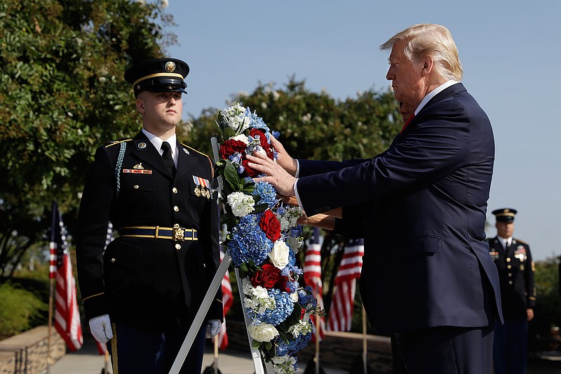 President Donald Trump and first lady Melania Trump place a wreath  and will participate in a moment of silence honoring the victims of the Sept. 11 terrorist attacks, Wednesday, Sept. 11, 2019, at the Pentagon. (AP Photo/Evan Vucci)