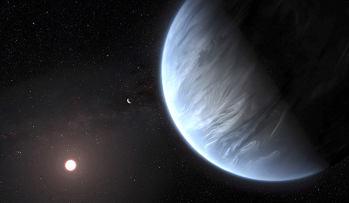 This artist's rendering provided by University College London Centre for Space Exochemistry Data researchers shows Exoplanet K2-18b, foreground, its host star and an accompanying planet in this system. On Wednesday, the scientists announced they discovered water on the planet outside our solar system that has temperatures suitable for life. (M. Kornmesser/ESA/Hubble via AP)