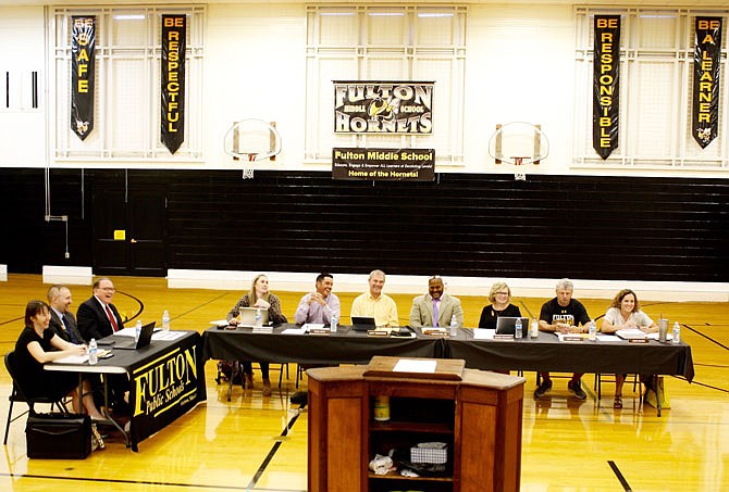 The Fulton Public Schools Board of Education held its September meeting Wednesday in the Fulton Middle School gym. Pictured, from left, are Karrie Millard, FPS director of special services; Assistant Superintendent Ty Crane; superintendent Jacque Cowherd; board president Emily Omohundro; Vice President Todd Gray; and board members Andy Bonderer, Verdis Lee Sr., Jackie Pritchett, Matt Gowin, and Leah Baker.