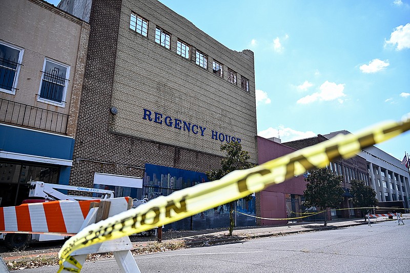 Caution tape and barriers cordon off the Regency House on Thursday in downtown Texarkana, Ark. The city's Public Works department will accept bids to demolish the building until the end of the month, with the goal of starting the process by the beginning of October.
