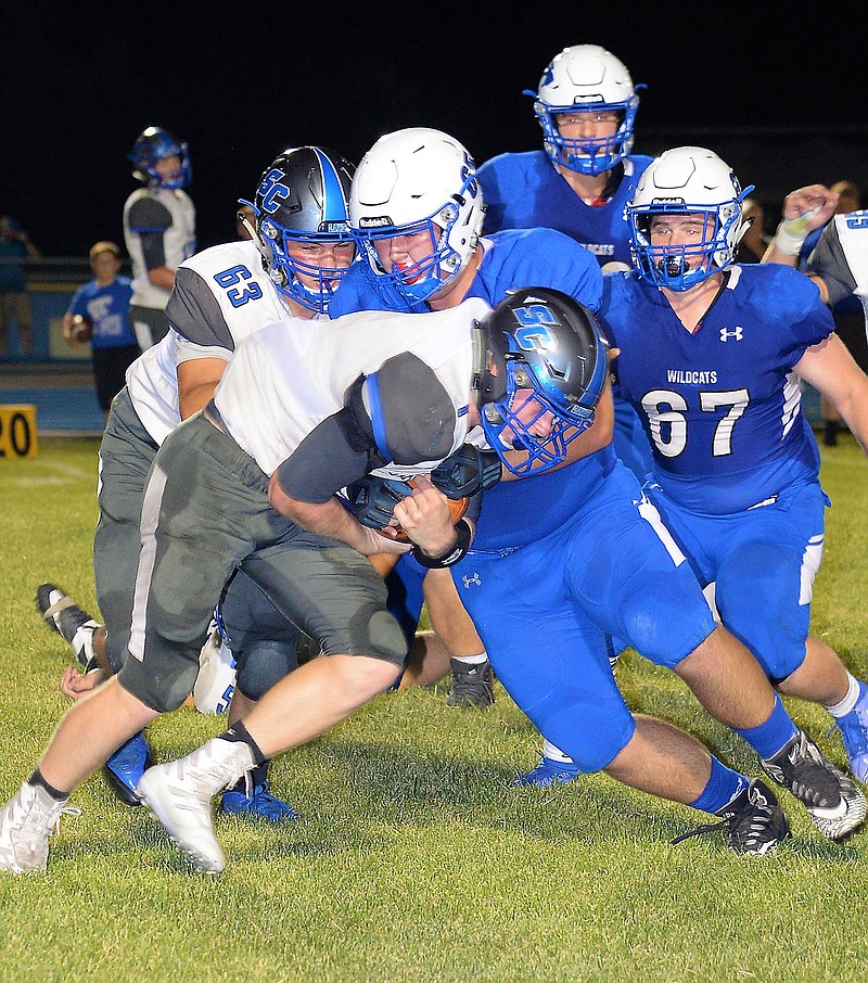 A Montgomery County defensive lineman smothers South Callaway senior running back Nick Mealy in the Bulldogs' 53-21 loss to the Wildcats in Friday night's EMO opener in Montgomery City.