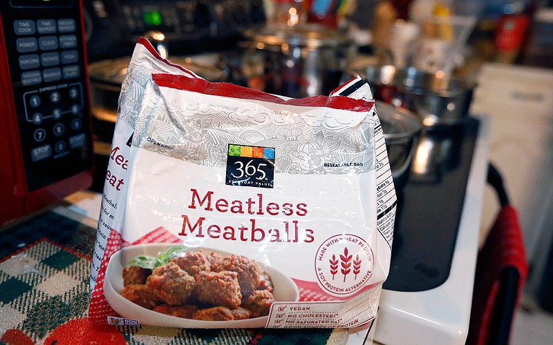 This July 2, 2019, file photo shows a bag of "meatless meatballs". Mississippi is considering new rules that let companies continue to use food-labeling terms such as "veggie burger" and "vegan bacon," as long as the terms are prominently displayed so consumers understand the products are not meat. The state agriculture department on Thursday, Sept. 5, 2019, proposed new regulations for plant-based products that are sold as alternatives to meat. The regulations came in response to a lawsuit filed by a nonprofit organization advocating plant-based foods and an Illinois food company. The lawsuit was filed on July 1, the same day the state enacted a law dictating that "a plant-based or insect-based food product shall not be labeled as meat or a meat food product." (AP Photo/Rogelio V. Solis, File)