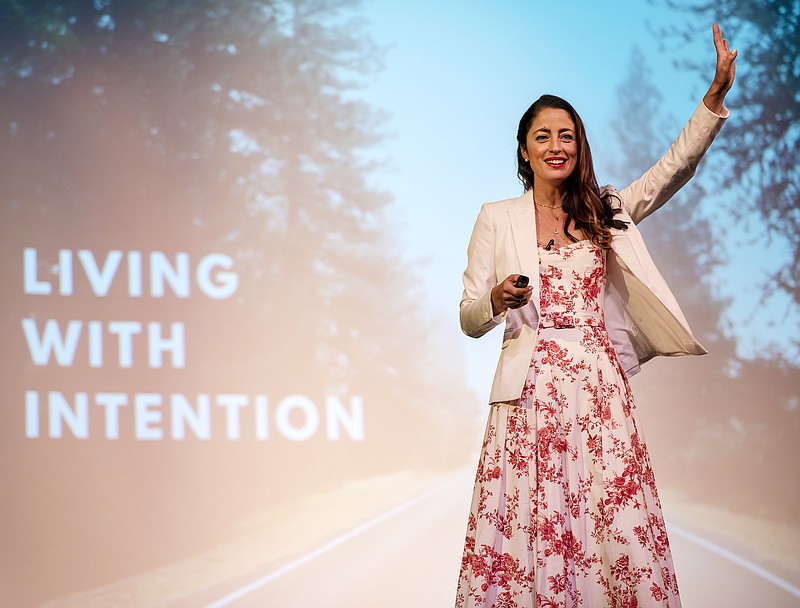 HALO founder Rebecca Welsh greets the crowd filling the Miller Center for Performing Arts auditorium before delivering the day's key speech, "Living With Intention," on Saturday, September 15, 2019, during the INSPIRE Women's Conference. Proceeds from the one-day event benefit the homeless and at-risk children of HALO. (Kris Wilson/News Tribune photo)
