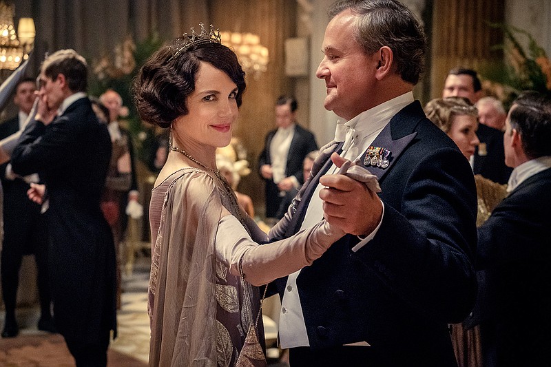This image released by Focus Features shows Elizabeth McGovern, left, as Lady Grantham and Hugh Bonneville, as Lord Grantham, in "Downton Abbey". The highly-anticipated film continuation of the "Masterpiece" series that wowed audiences for six seasons, will be released Sept. 13, 2019, in the United Kingdom and on Sept. 20 in the United States. (Jaap Buitendijk/Focus Features via AP)