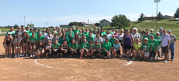 Alumni of the Blair Oaks softball program, from its inaugural season in 1974 to the seniors from the 2018 season, gather for the Blair Oaks softball reunion following Saturday's game against Troy-Buchanan at the Falcon Athletic Complex in Wardsville.