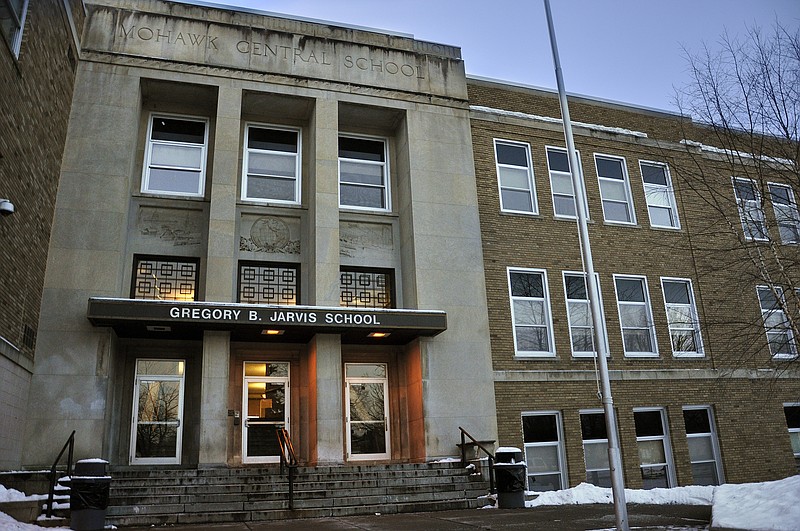 FILE - This Feb. 1, 2010 file photo, shows Gregory B. Jarvis Junior/Senior High School in Mohawk, NY. At the beginning of the 2019-2020 academic year, New York became the first state that empowers schools to petition courts for temporary removal of firearms from people believed to be a danger to themselves or others. (AP Photo/Heather Ainsworth, File)