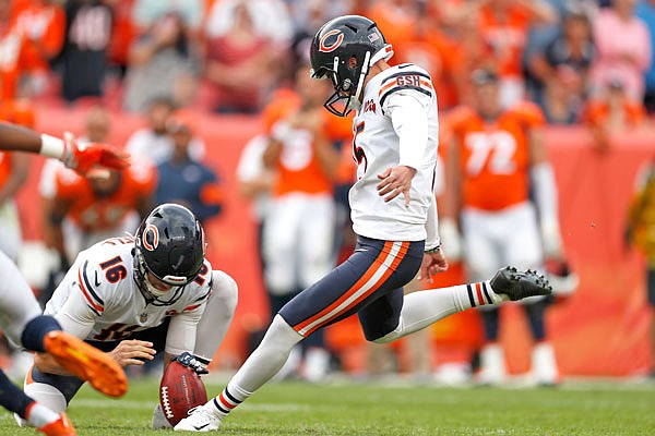 Bears kicker Eddy Pineiro kicks the game-winning field goal as punter Pat O'Donnell holds during the second half of Sunday's game against the Broncos in Denver. The Bears won 16-14.