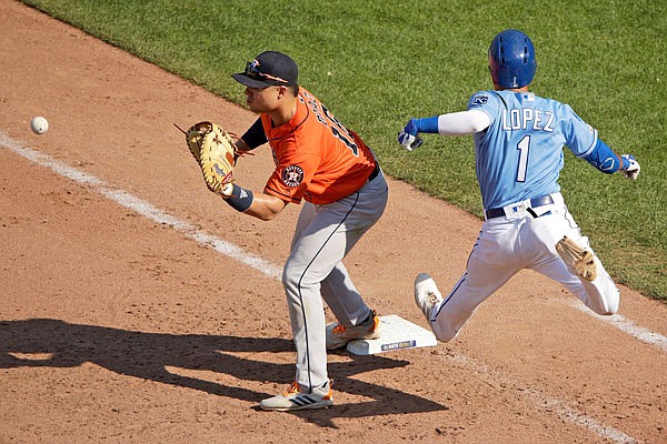 Nicky Lopez of the Royals tries to beat the throw to Astros first baseman Aledmys Diaz during the ninth inning of Sunday afternoon's game at Kauffman Stadium.