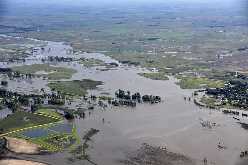 This Saturday, Sept. 14, 2019 photo provided by the South Dakota Civil Air Patrol shows an aerial view of the flooding in Spencer, S.D. Flooding from torrential rain that's soaked much of southeastern South Dakota has closed schools for a second day, submerged city streets and caused some to evacuate their homes.  (South Dakota Civil Air Patrol via AP)