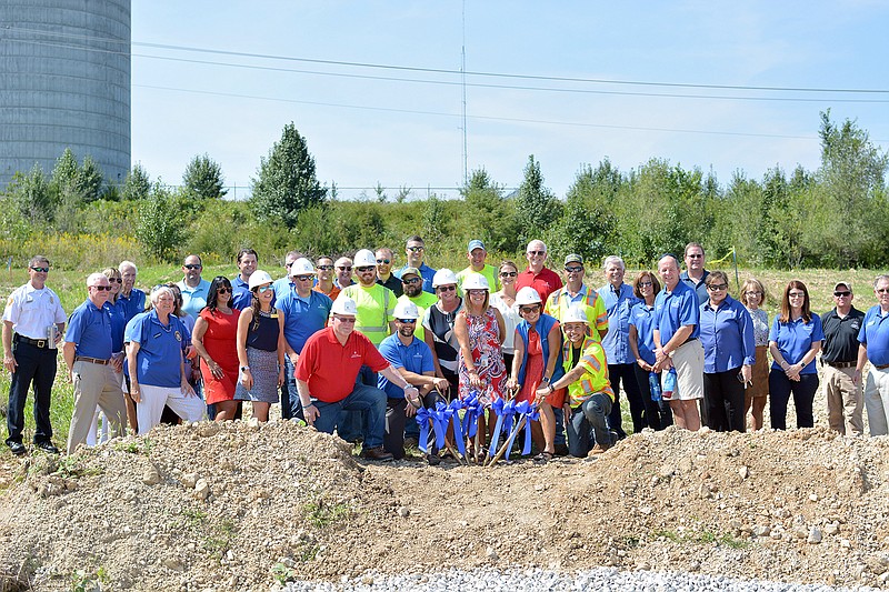 Local elected officials, chamber members and employees with Missouri American Water break ground Monday during a groundbreaking ceremony on Hoover Road. American water will build a $4.3 million service center on the plot that will serve Jefferson City and surrounding communities.