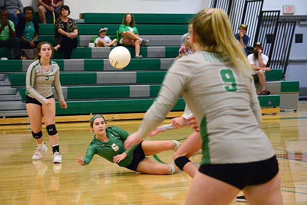 Tori Martin of Blair Oaks dives for a pass during Monday night's match against Battle in Wardsville.