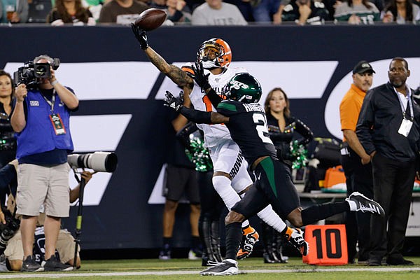 Browns receiver Odell Beckham catches a pass as Nate Hairston defends during Monday night's game in East Rutherford, N.J.