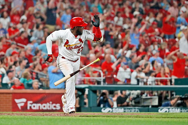 Marcell Ozuna of the Cardinals watches his ground-rule double that scored two runs in the seventh inning of Monday night's game against the Nationals at Busch Stadium.