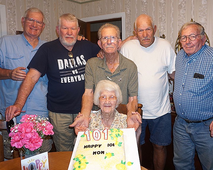 Katie Evalee Clayton poses with her five sons, from left, Gary, Larry, Ronnie, Carroll and Maurice Clayton  during her 101st birthday celebration Sunday in Queen City, Texas. Staff photo by Neil Abeles