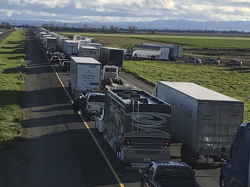 This Feb. 14, 2019, photo released by Caltrans District 3 shows a 7-mile back up on the South bound Interstate 5, as it reopens to traffic in Maxwell in Colusa County, Calif. The Trump administration is poised revoke California’s authority to set auto mileage standards, asserting that only the federal government has the power to regulate greenhouse gas emissions and fuel economy. (Caltrans District 3 via AP)