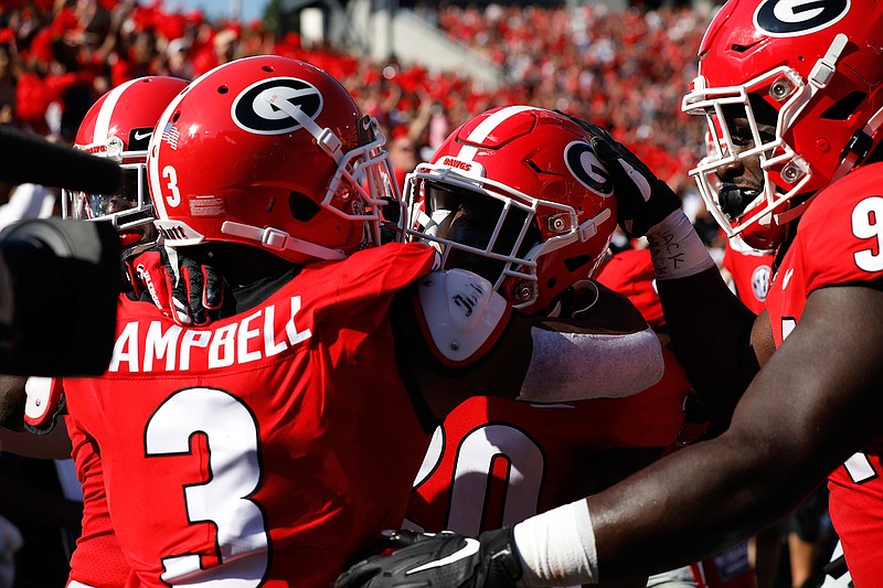 Georgia defensive back J.R. Reed (20) celebrates with teammates after scoring a touchdown against Murray State on Sept. 7 in Athens, Ga. 
