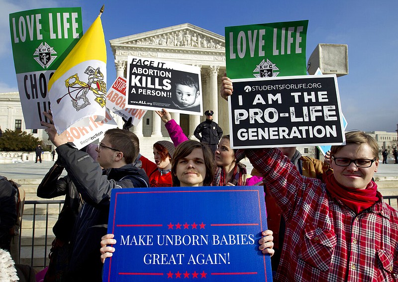 In this Jan. 18, 2019, photo, anti-abortion activists protest outside of the U.S. Supreme Court, during the March for Life in Washington. The number and rate of abortions across the United States have plunged to their lowest levels since the procedure became legal nationwide in 1973, according to new figures released Wednesday, Sept. 18.