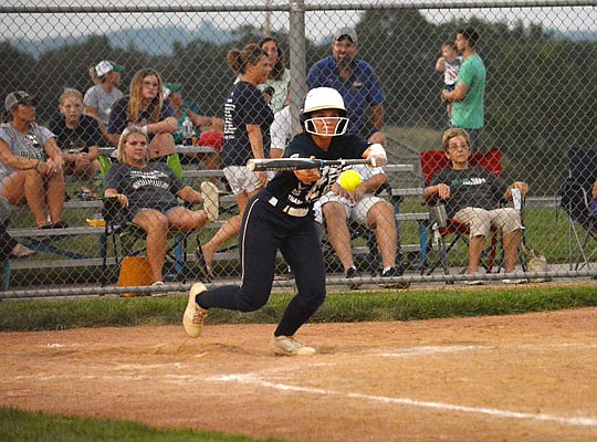 Paige Luebbering of Helias lays down a bunt during Tuesday night's game against Blair Oaks at the Falcon Athletic Complex in Wardsville.