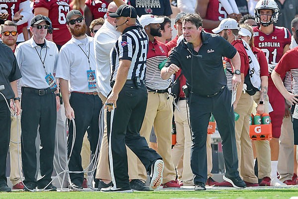 South Carolina coach Will Muschamp has a word with an official during the first half of last Saturday's game against Alabama in Columbia, S.C.